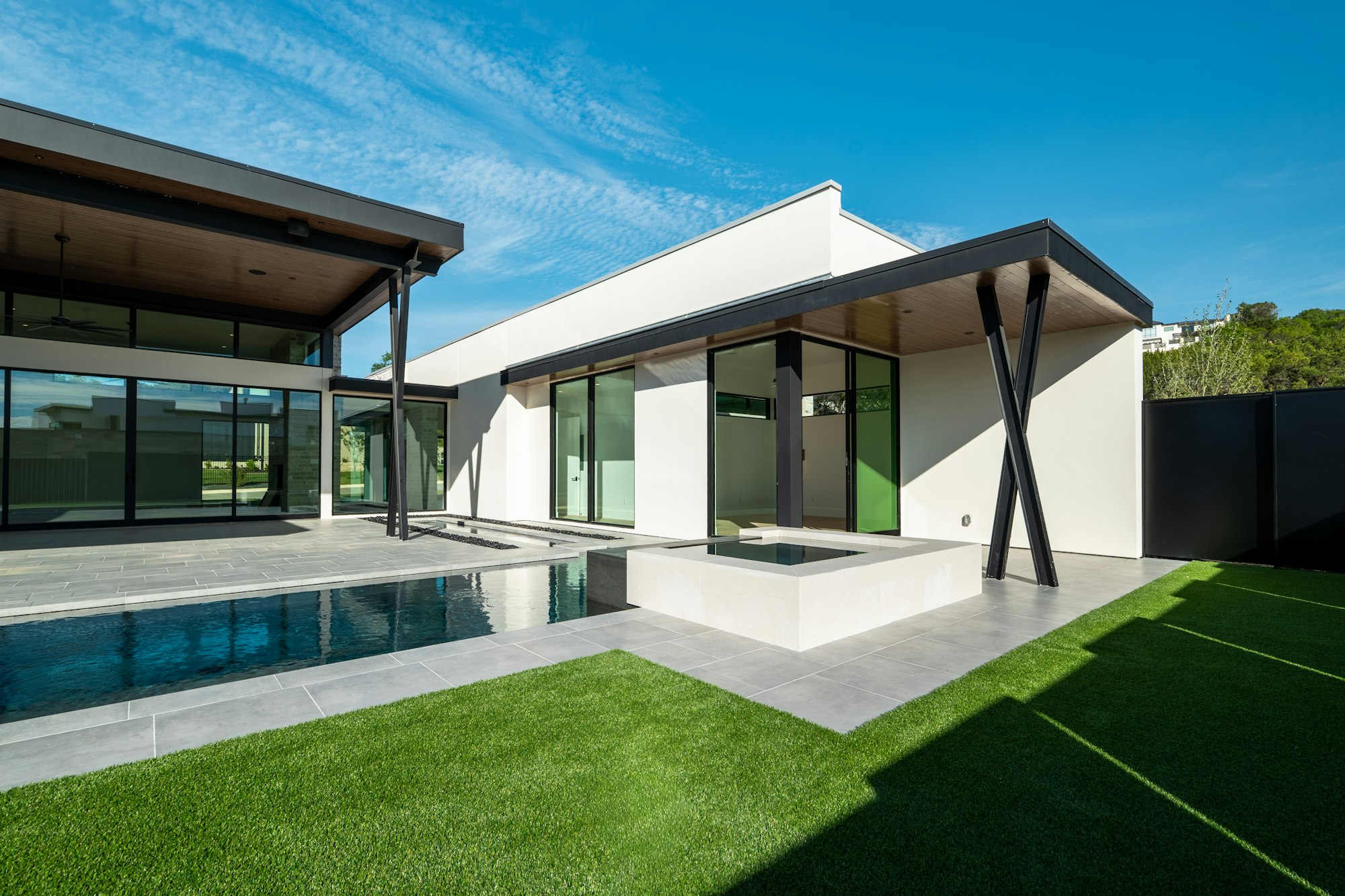 Modern villa with pool, lawn and covered terrace