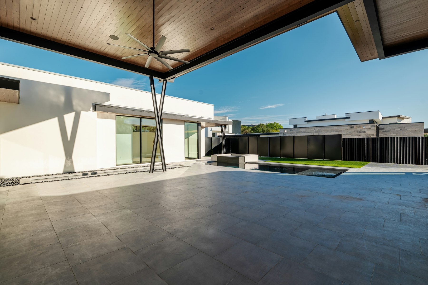 Covered patio opening onto a pool